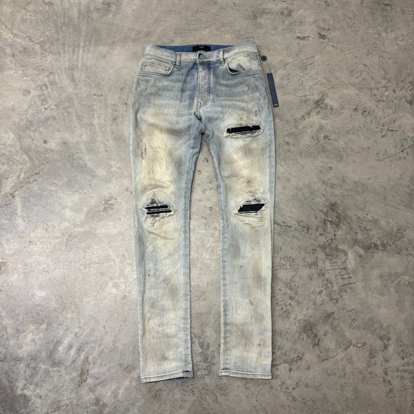 AMIRI JEANS “MX1 DARK NAVY PATCH” RUST