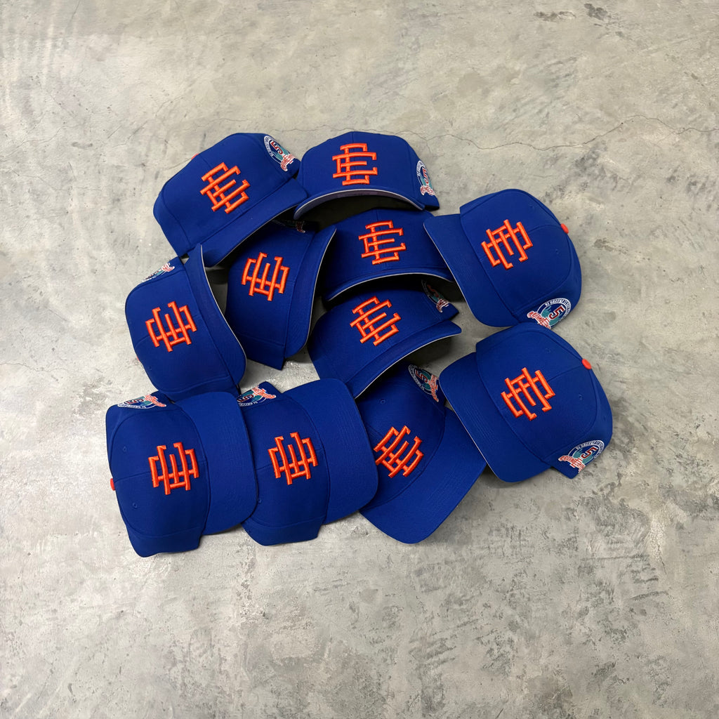 ERIC EMANUEL “BLUE/ORANGE” ADJUSTABLE TRUCKER HAT